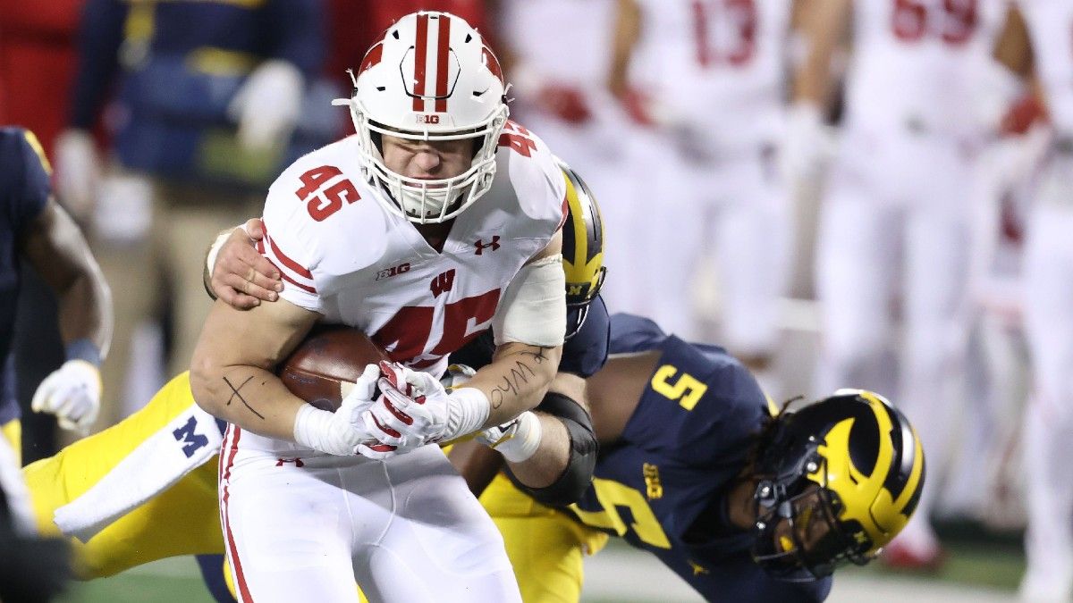 College Football Odds & Picks for Wisconsin vs. Michigan: What Bet to Target in Big Ten Showdown article feature image