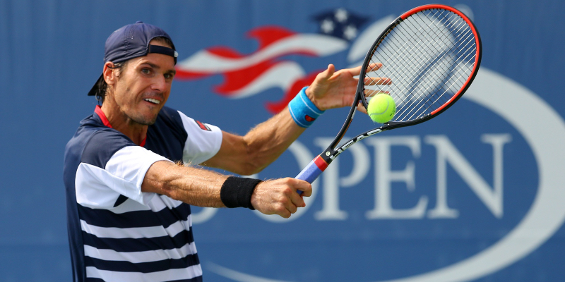 Tommy Haas of Germany returns a shot against Fernando Verdasco of Spain on day one of the 2015 U.S. Open tennis tournament at USTA Billie Jean King National Tennis Center.