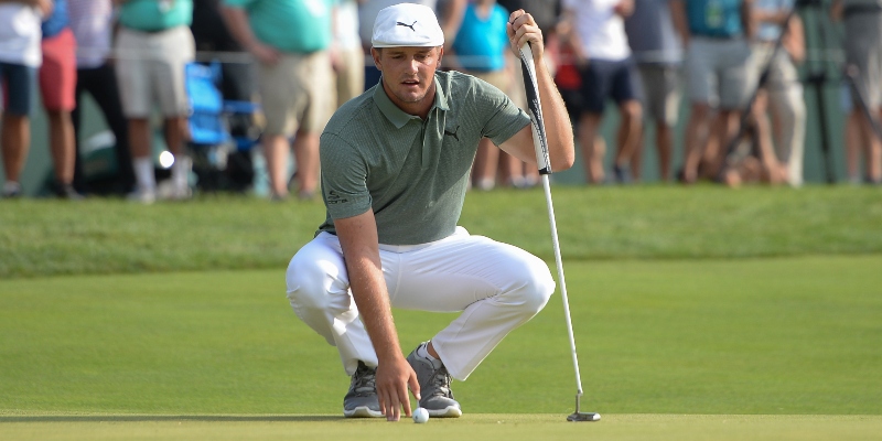Bryson DeChambeau (USA) lines up a putt on the 17th hole during the third round of The Northern Trust golf tournament at Ridgewood Country Club.