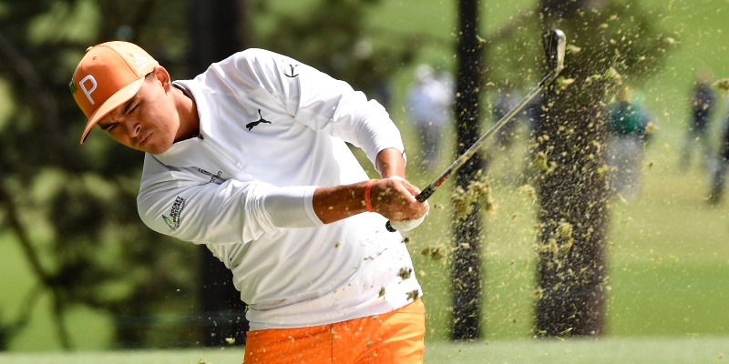 Rickie Fowler hits from the fairway on the 1st hole during the final round of the Masters golf tournament at Augusta National Golf Club.