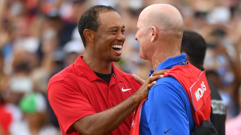 Tiger Woods hugs his caddie Joe LaCava after winning the Tour Championship golf tournament at East Lake Golf Club.