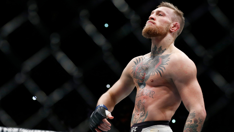 Conor McGregor (blue gloves) celebrates after defeating Eddie Alvarez (red gloves) in their lightweight title bout during UFC 205 at Madison Square Garden.