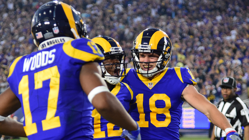 Los Angeles Rams wide receiver Robert Woods (17) celebrates with wide receiver Cooper Kupp (18) and wide receiver Brandin Cooks (12) after catching a touchdown pass in the second quarter against the Minnesota Vikings at the Los Angeles Memorial Coliseum.