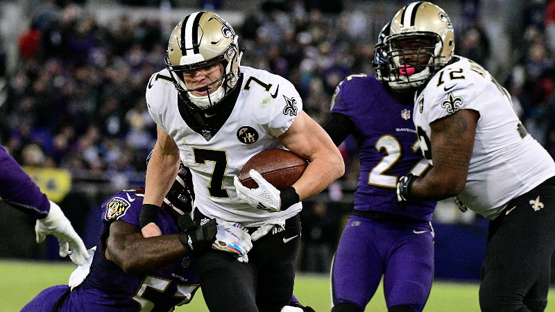 New Orleans Saints quarterback Taysom Hill (7) runs for a first down against the Baltimore Ravens at M&T Bank Stadium.