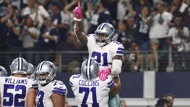 Dallas Cowboys running back Ezekiel Elliott (21) celebrates his fourth quarter touchdown with tackle La'el Collins (71) against the Jacksonville Jaguars at AT&T Stadium.