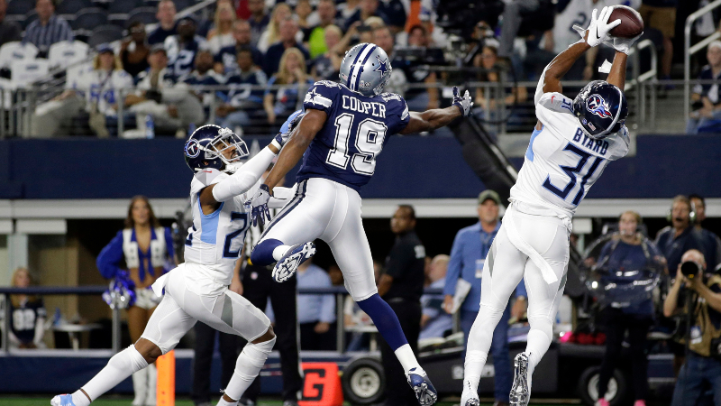 ennessee Titans free safety Kevin Byard (31) intercepts a pass against Dallas Cowboys wide receiver Amari Cooper (19) in the first quarter at AT&T Stadium.