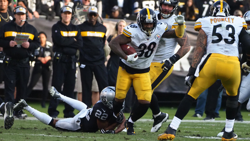 Pittsburgh Steelers running back Jaylen Samuels (38) carries the ball against Oakland Raiders cornerback Rashaan Melvin (22) during the third quarter at Oakland Coliseum.