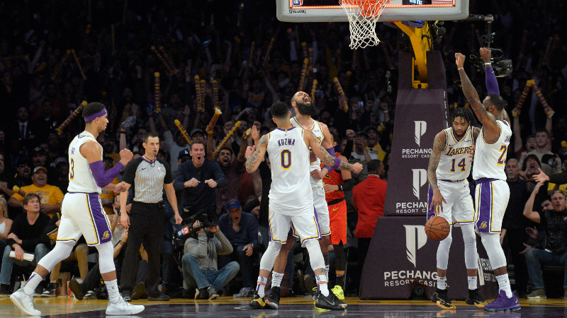 Los Angeles Lakers center Tyson Chandler (center) celebrates with forward Kyle Kuzma (0) guard Josh Hart (3) forward Brandon Ingram (14) and forward LeBron James (23) after blocking the shot of Atlanta Hawks guard Trae Young (not seen) to end the game with a 107-106 win over the Hawks at Staples Center.