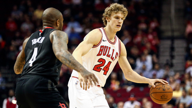 Chicago Bulls forward Lauri Markkanen (24) dribbles the ball as Houston Rockets forward PJ Tucker (4) defends during the first quarter at Toyota Center.