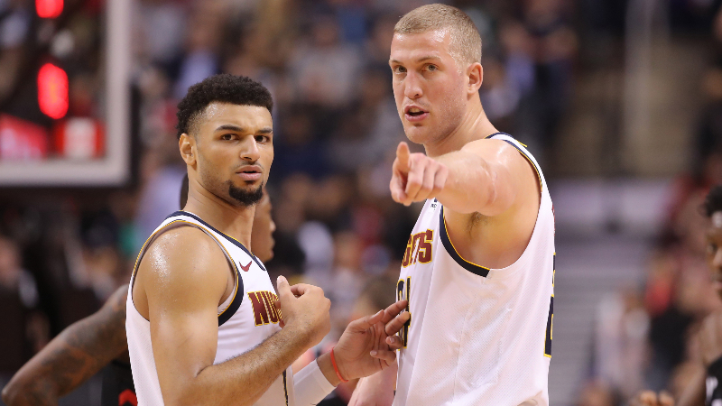 Denver Nuggets forward Mason Plumlee (24) talks to guard Jamal Murray (27) against the Toronto Raptors at Scotiabank Arena. The Nuggets beat the Raptors 106-103.