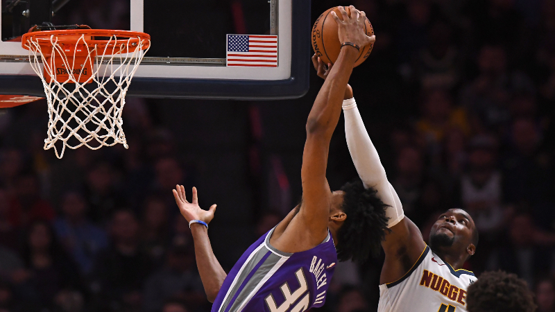 Denver Nuggets forward Paul Millsap (4) blocks a shoot attempt by Sacramento Kings forward Marvin Bagley III (35) in the third quarter at Pepsi Center.