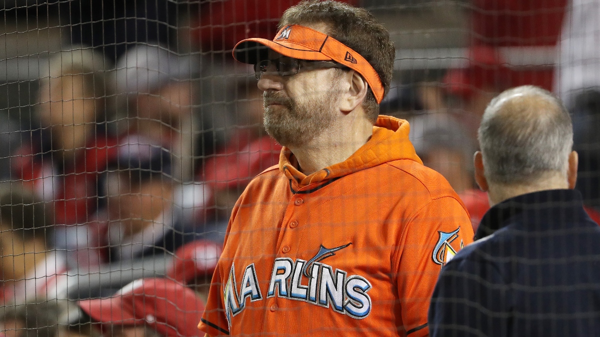 man in marlins jersey at baseball games