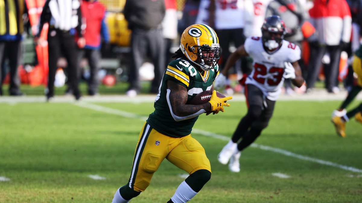 Packers Aaron Jones Impact Jersey Framed Photo at the Packers Pro Shop