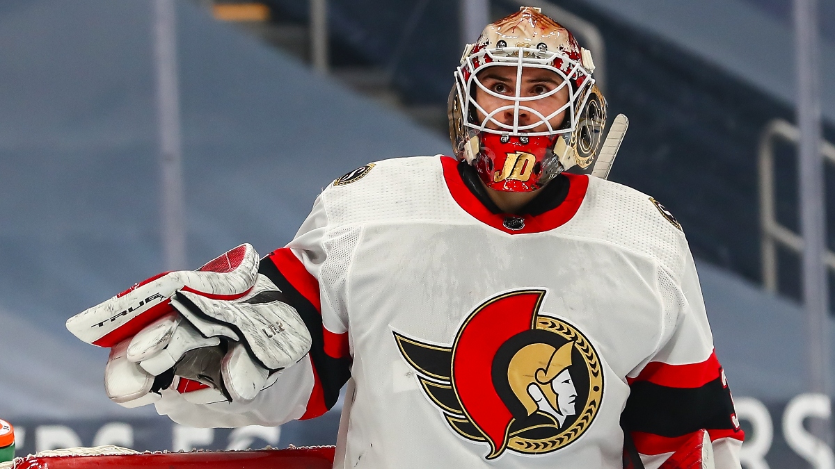 The puck comes out of Ottawa Senators goaltender Joey Daccord's