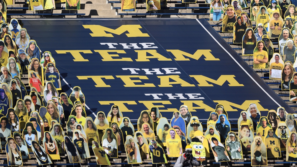 M Den selling Michigan football jerseys with players' names on the back 