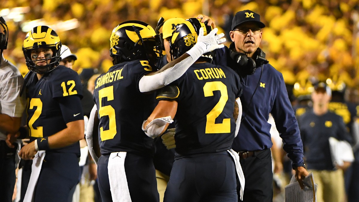 Michigan vs. Wisconsin College Football Odds & Picks: How To Bet Saturday’s Big Ten Battle (Oct. 2) article feature image
