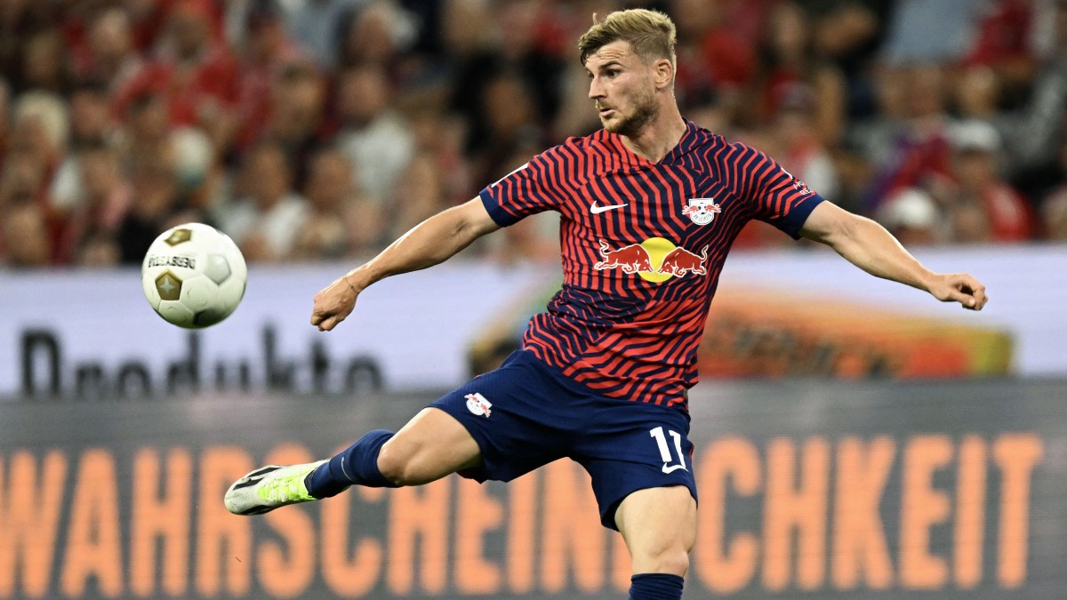 Leipzig's Benjamin Sesko, top, heads the ball during the German