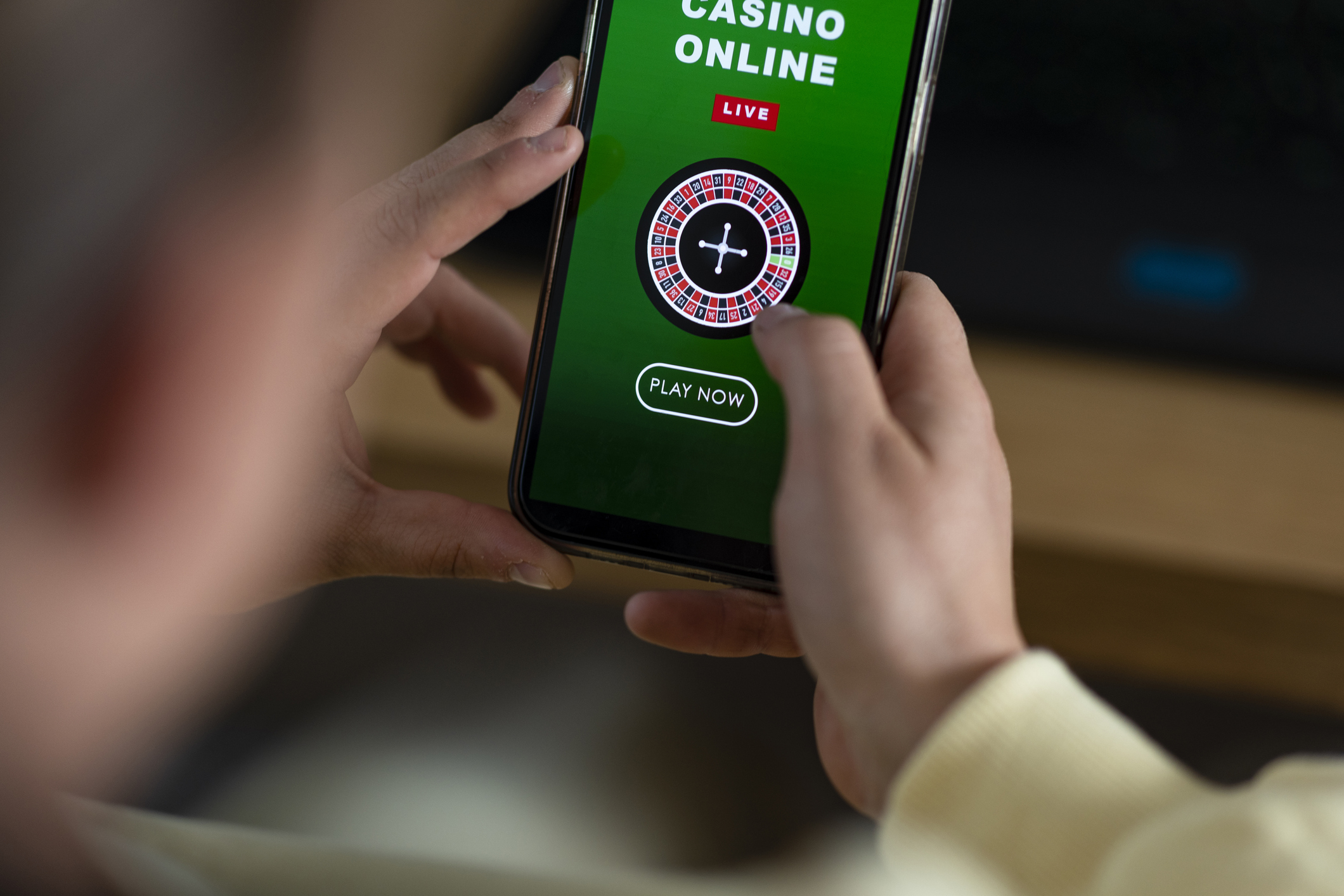 using a smart phone to gamble in an online casino.