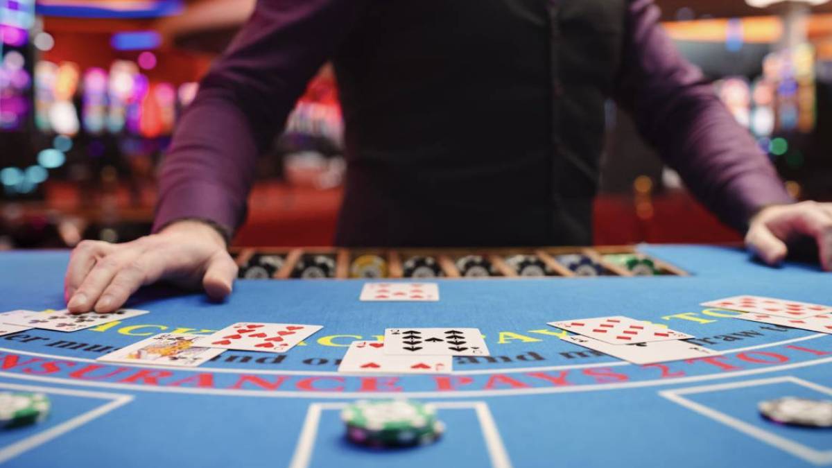 an image of a blacjack dealer where colorado casinos saw revenue climb in november but come back down to earth according to december figures.