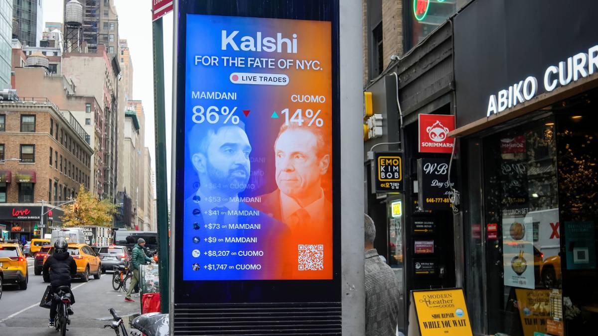 image of Kalshi ad showing percentages on new york mayoral race. Prediction markets platforms operate under the oversight of the Commodity Futures Trading Commission (CFTC) as financial derivatives or event contracts, rather than under traditional gambling regulations.