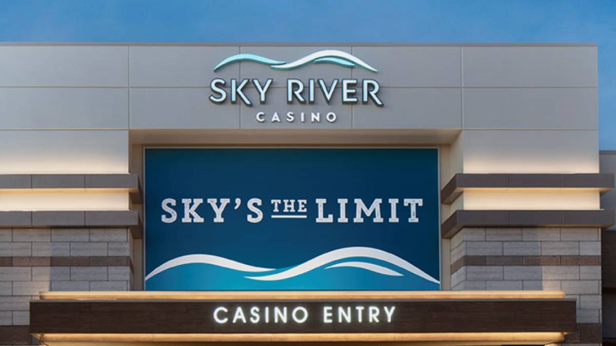 "Entrance of Sky River Casino in Elk Grove, California, featuring modern architecture and illuminated signage at night.