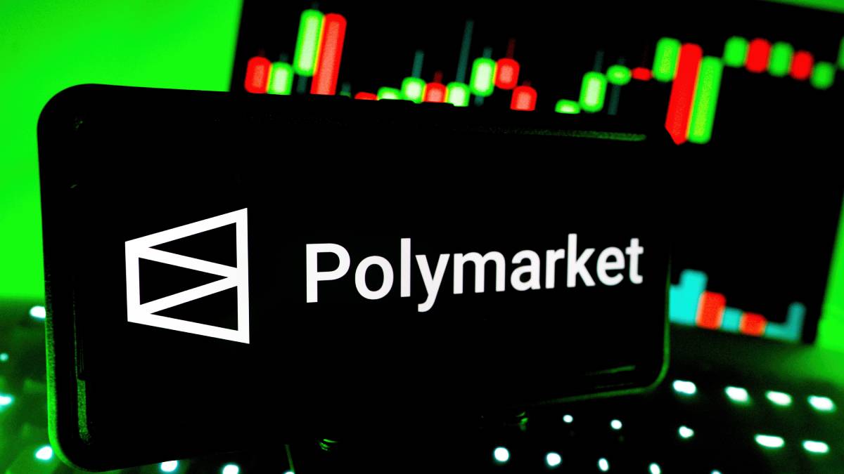 Polymarket Prediction Market app is a trading platform with a Logo Displayed On Digital Screen With Stock Market Performance Chart Background