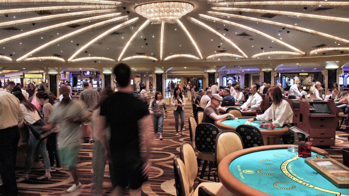 Image of a bustling casino floor, illustrating the challenge of legalizing casinos in Texas as the state navigates complex legal and political barriers to bringing such environments to life.