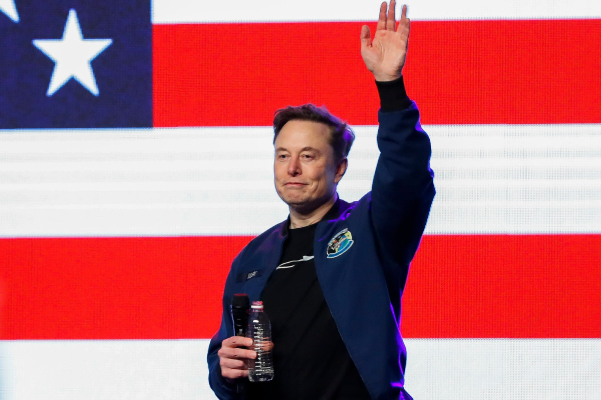 Elon Musk waves to crowd