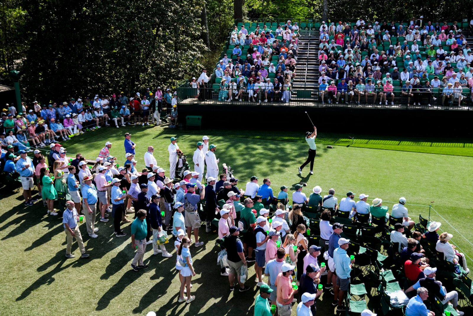 Nicolas Echavarria tees off in front of a packed crowd during the Masters in 2025.