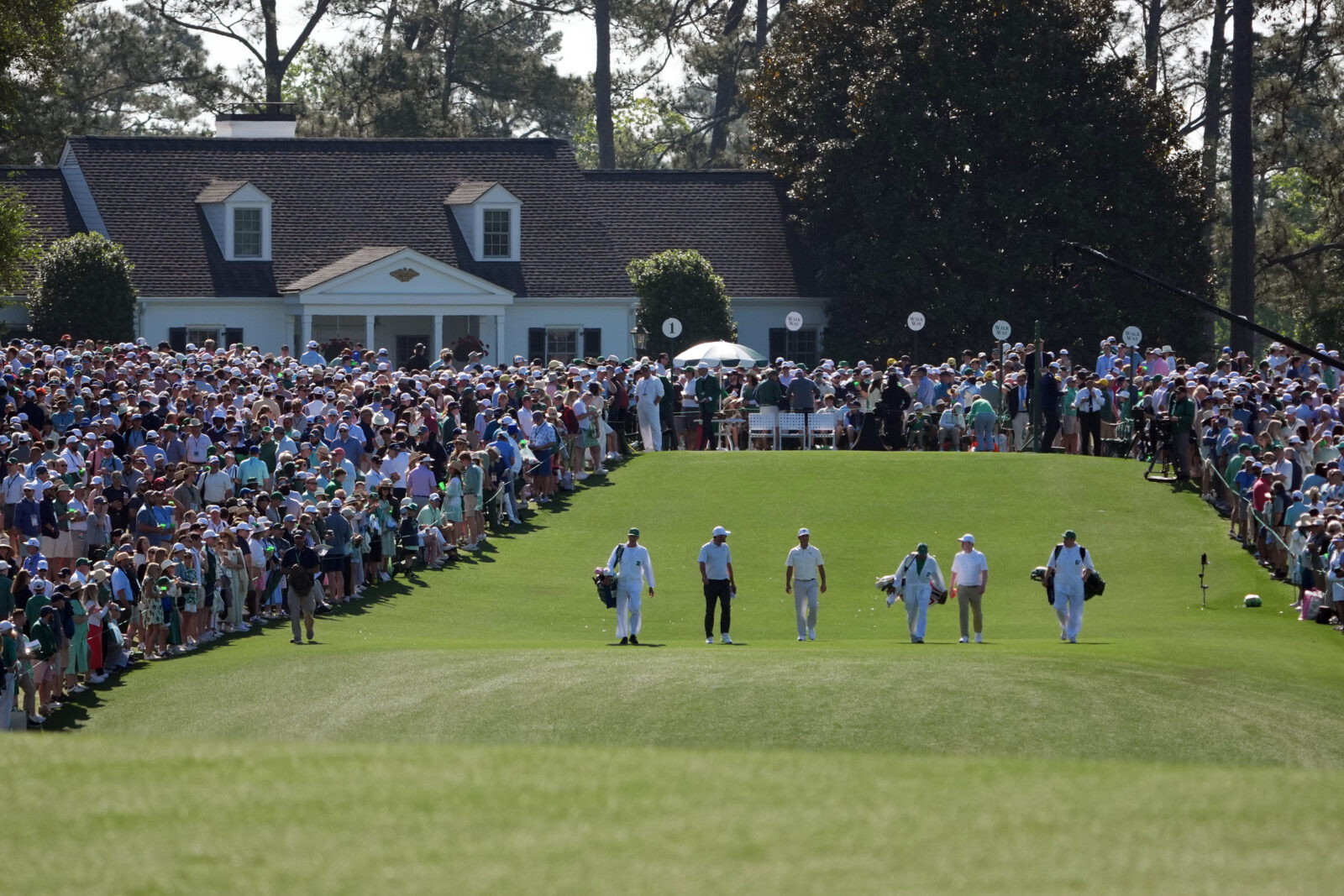 Apr 10, 2026; Augusta, Georgia, USA; Scottie Scheffler, Gary Woodland, and Robert MacIntyre walk down the first fairway during the second round of the Masters Tournament at Augusta National Golf Club.