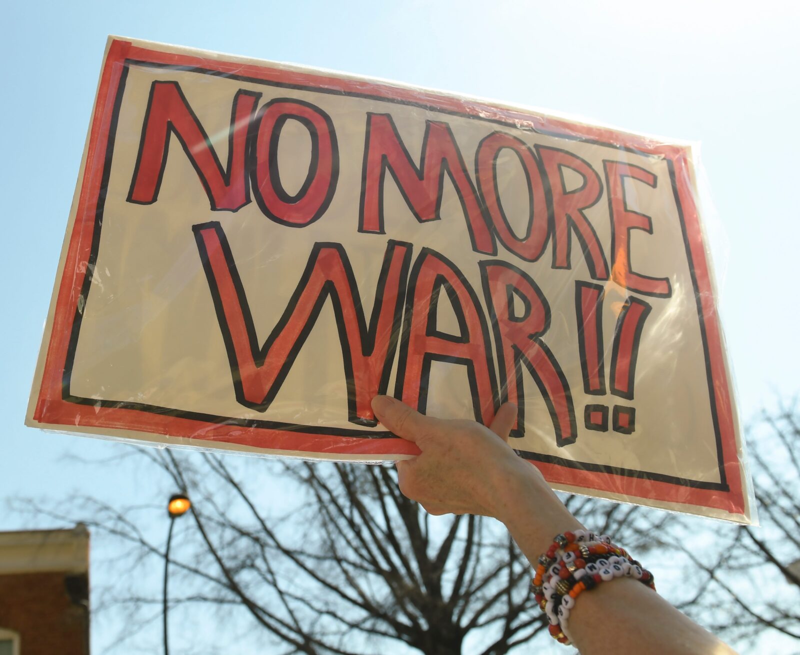 A sign is held up Sunday, March 1, 2026, during a protest following the death of Iran Supreme Leader Ayatollah Ali Khamenei by US and Israeli strikes. Photo taken in downtown Greenville, South Carolina.