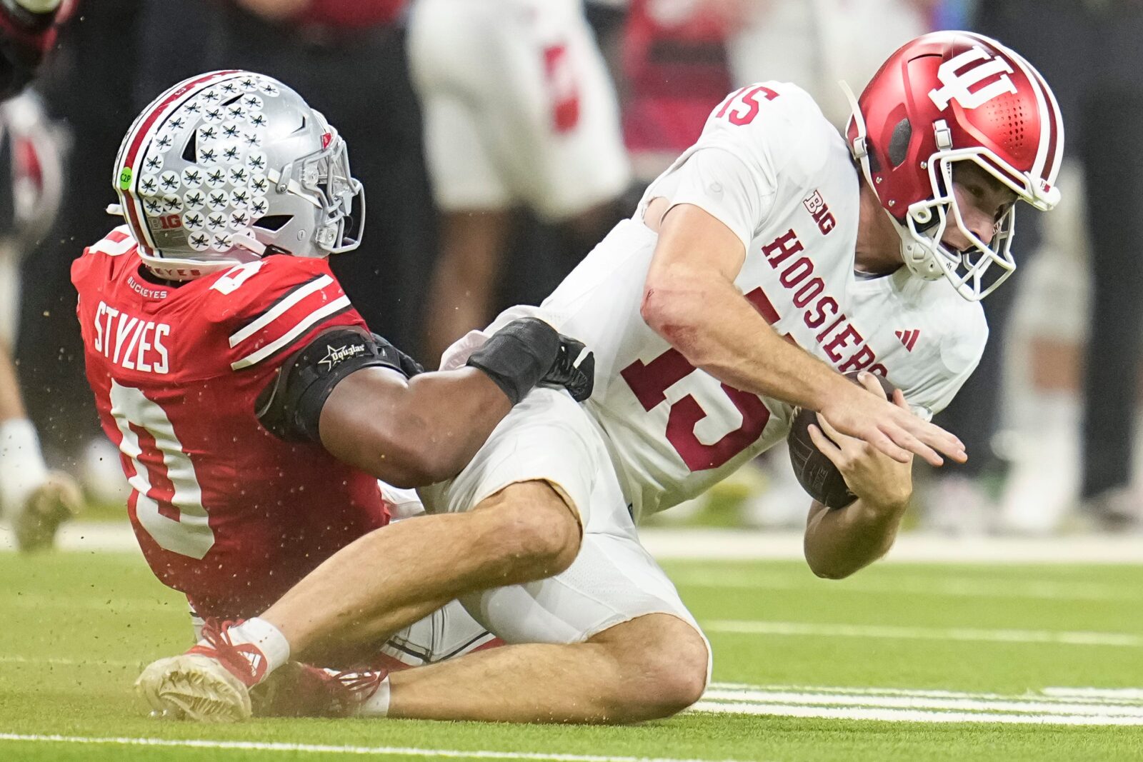 Ohio State Buckeyes linebacker Sonny Styles (0) hits Indiana Hoosiers quarterback Fernando Mendoza (15)