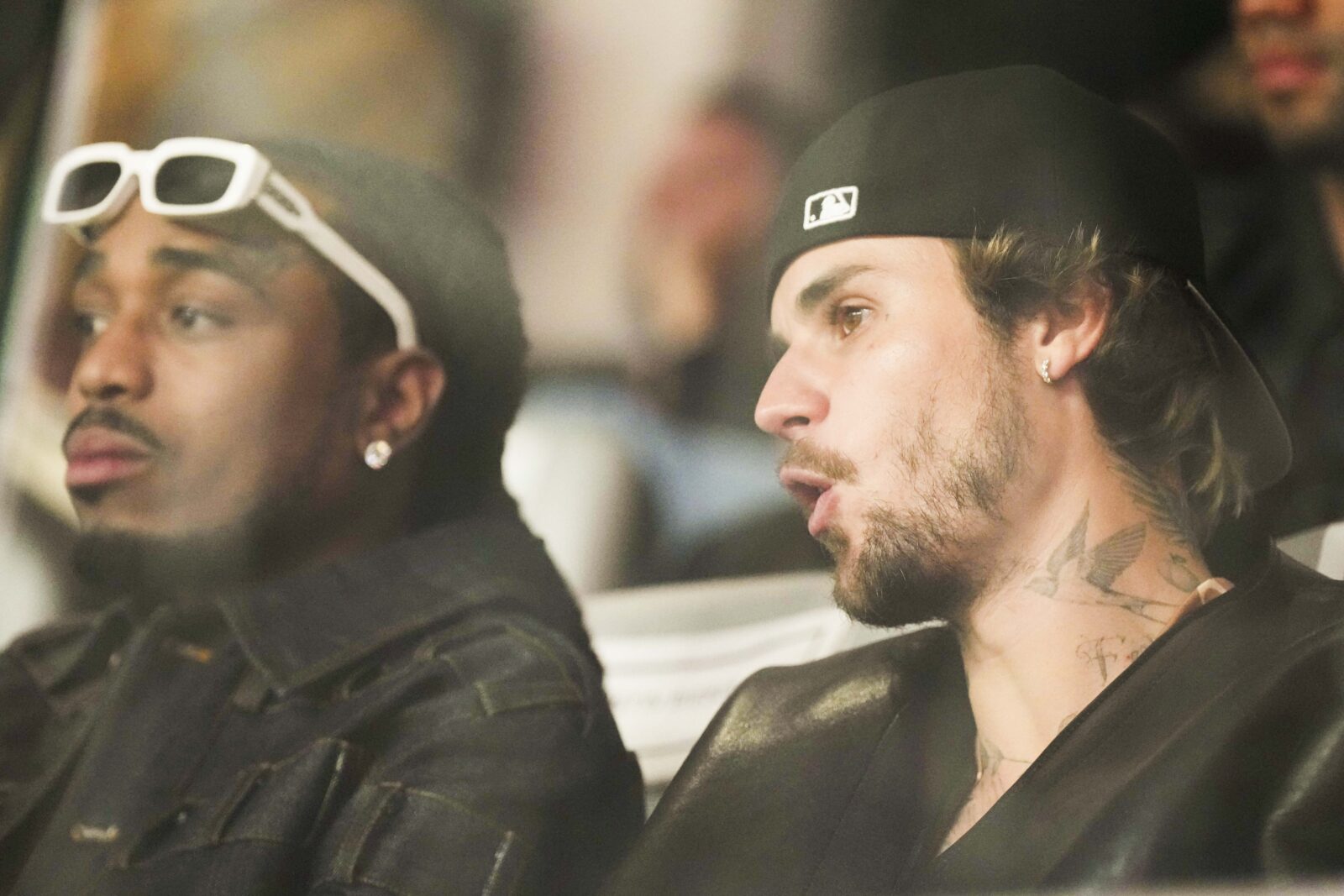 Recording artists Justin Bieber and Quavo watch gameplay during the third quarter of Super Bowl LVIII.