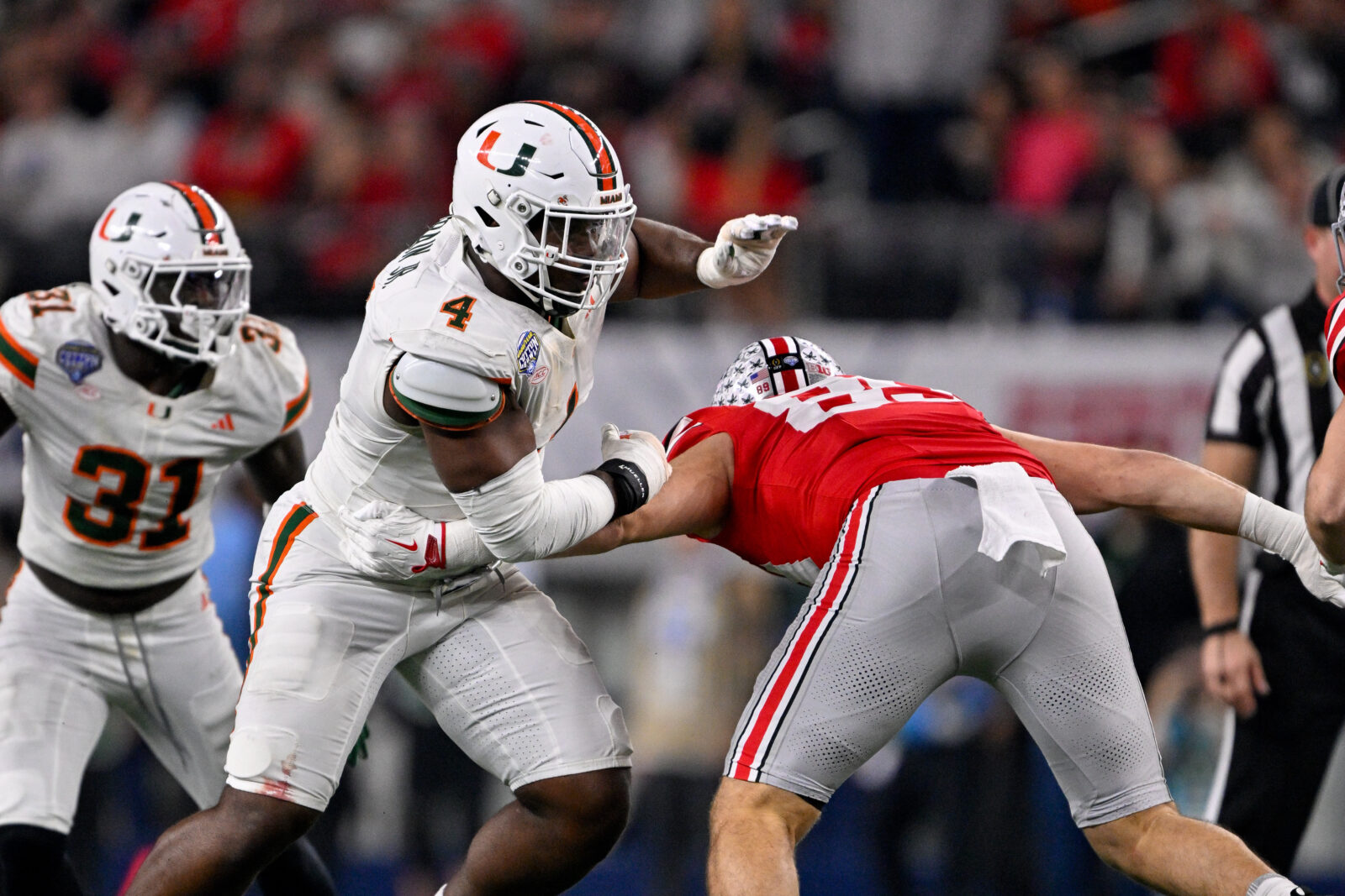 Miami Hurricanes defensive lineman Rueben Bain Jr. rushes the line during the 2025 Cotton Bowl and quarterfinal game of the College Football Playoff at AT&T Stadium. 