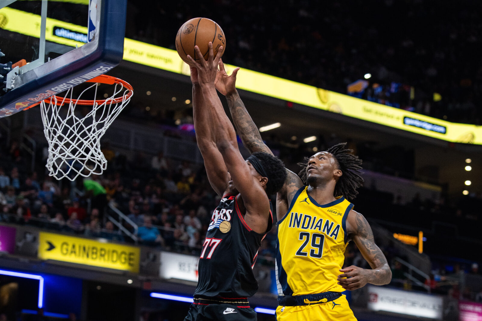 Philadelphia 76ers guard Vj Edgecombe (77) shoots the ball while Indiana Pacers guard Quenton Jackson (29) defends in the second half at Gainbridge Fieldhouse.