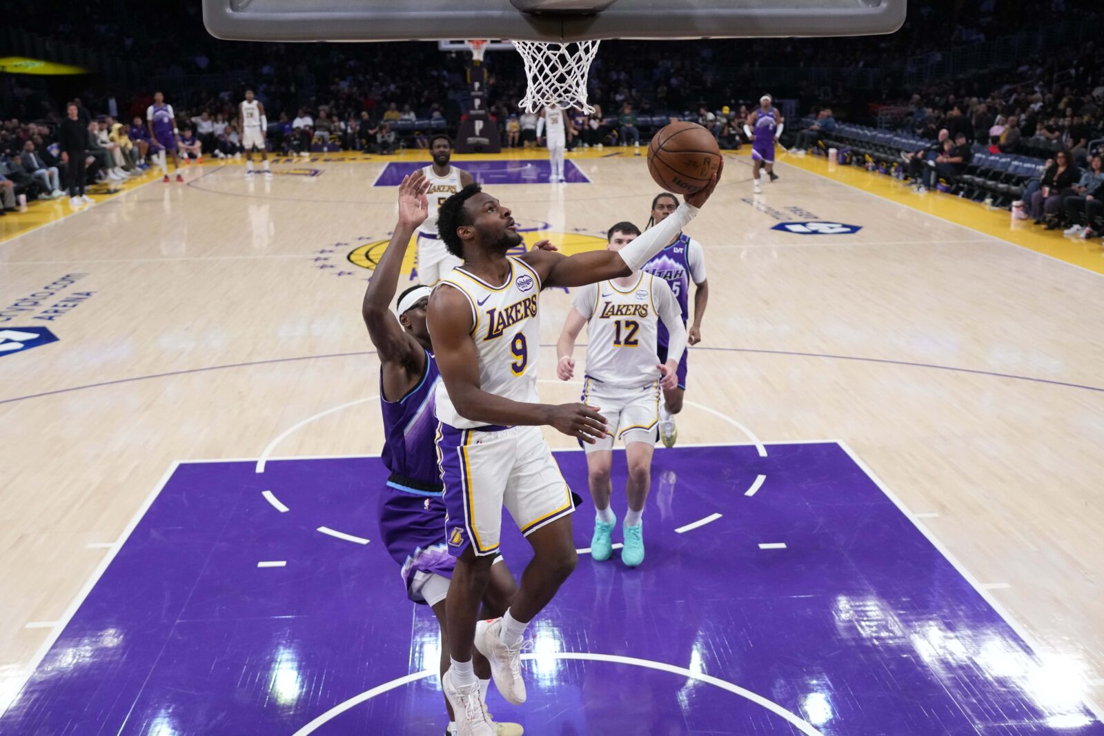 Apr 12, 2026; Los Angeles, California; Los Angeles Lakers guard Bronny James (9) shoots the ball against the Utah Jazz in the second half at Crypto.com Arena.
