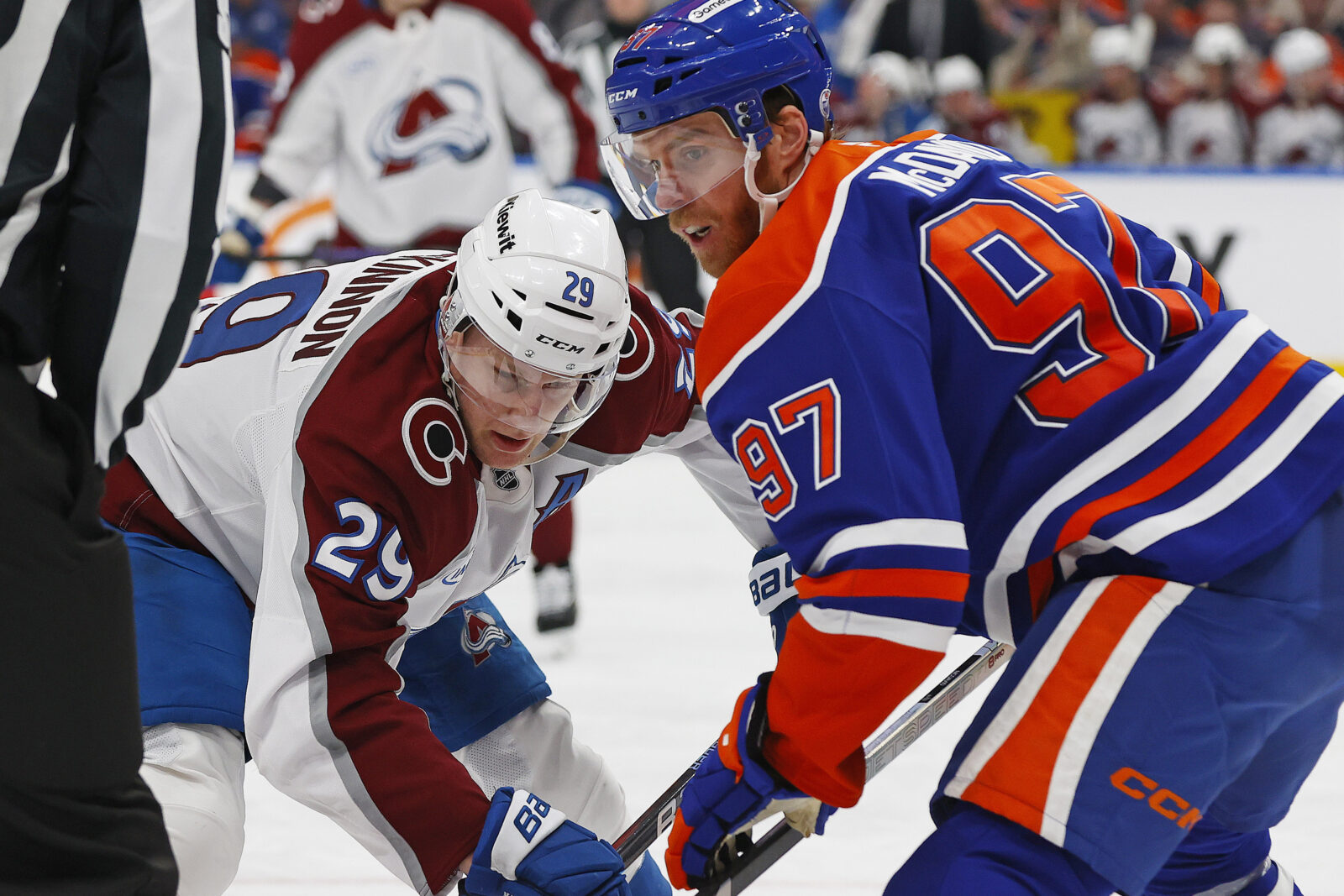 Edmonton Oilers forward Connor McDavid (97) and Colorado Avalanche forward Nathan MacKinnon (29) battle in a face-off during the second period at Rogers Place.