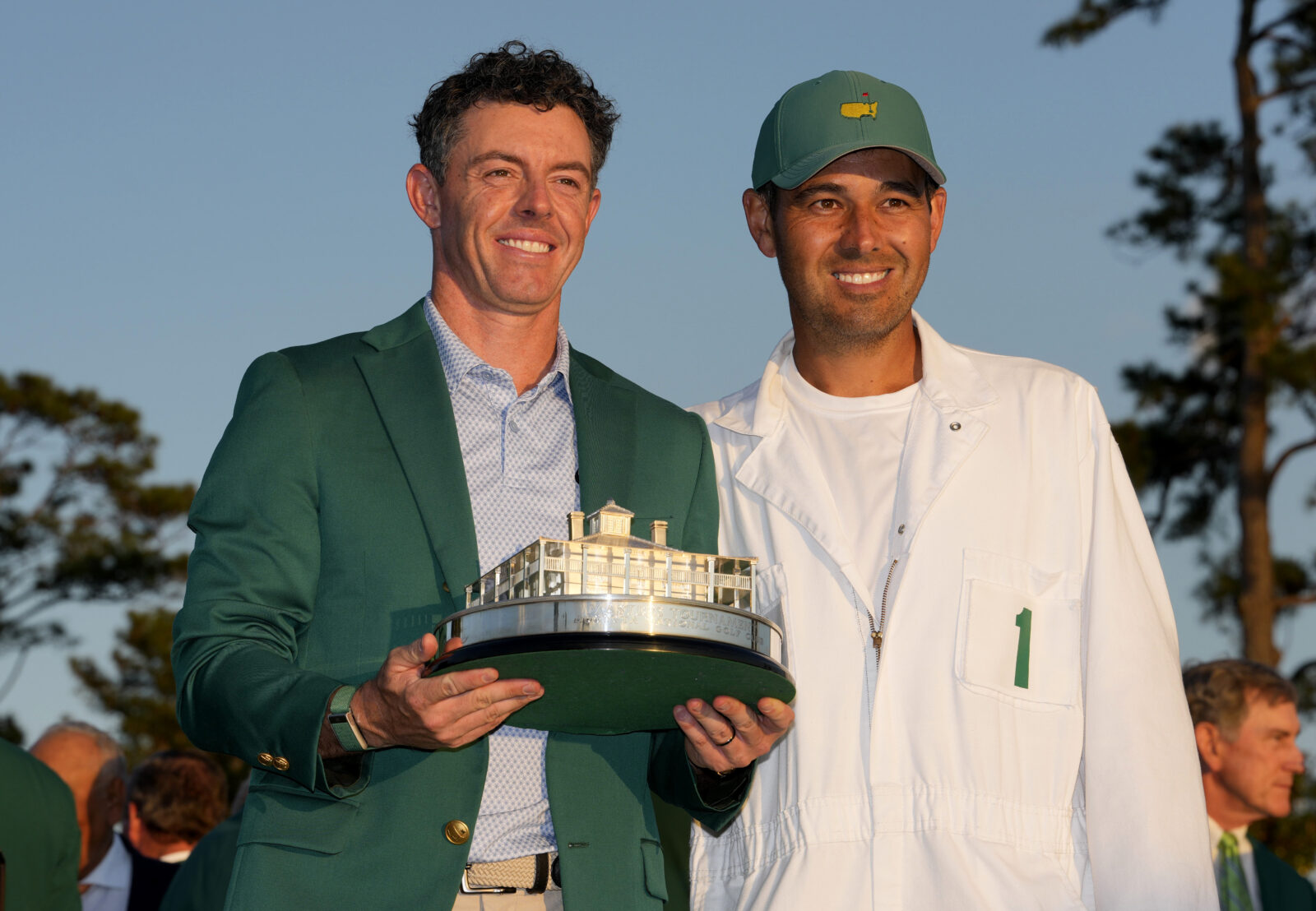 Rory McIlroy poses for a photo with his caddie, Harry Diamond, with the Masters championship trophy during the green jacket ceremony after the final round of the Masters Tournament at Augusta National Golf Club.
