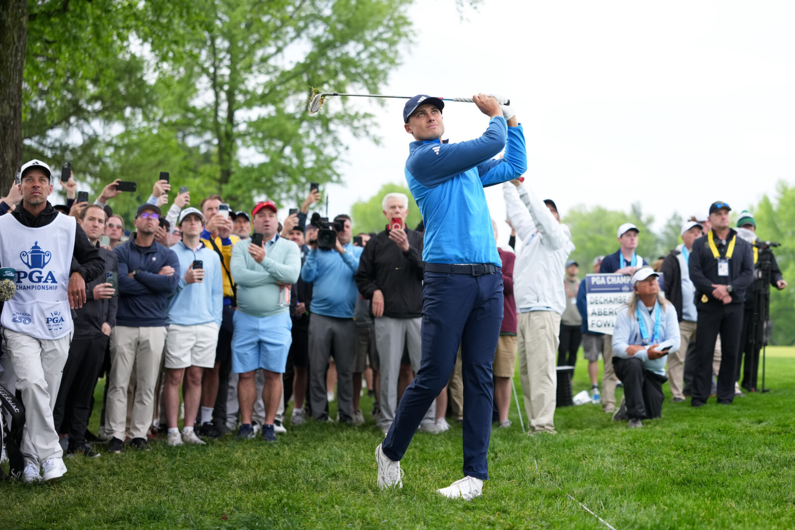 Ludvig Aberg plays his shot on the 13th hole during the first round of the PGA Championship golf tournament at Aronimink Golf Club.