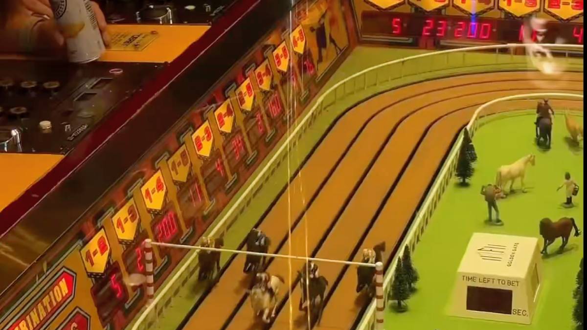 Vintage Sigma Derby machine showcasing electro-mechanical design and racing track