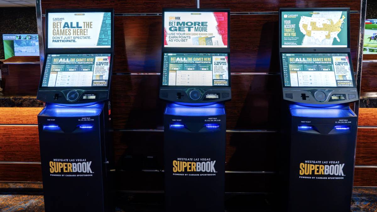 Caesars Sportsbook betting kiosks and branding displayed inside the Westgate SuperBook in Las Vegas.