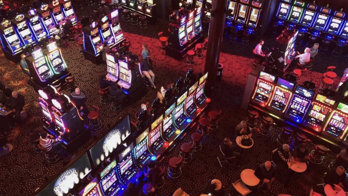 Inside Happy Valley casino showing slot machines and table games