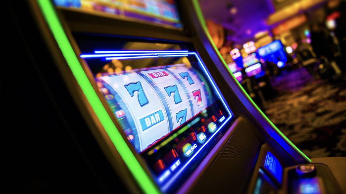 a slot machine in a las vegas casino, but many slot machines are now expanding beyond the casino floor and into gas stations and convenience stores.