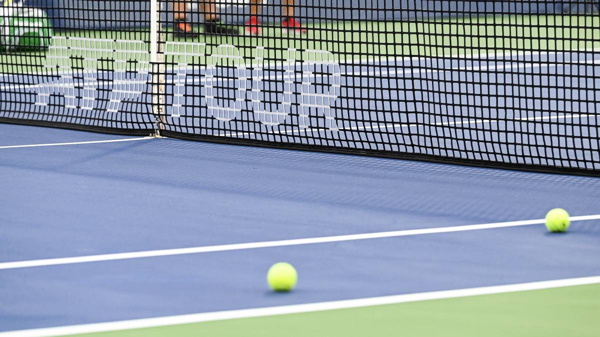 ATP tennis court with a hard surface and professional stadium seating.
