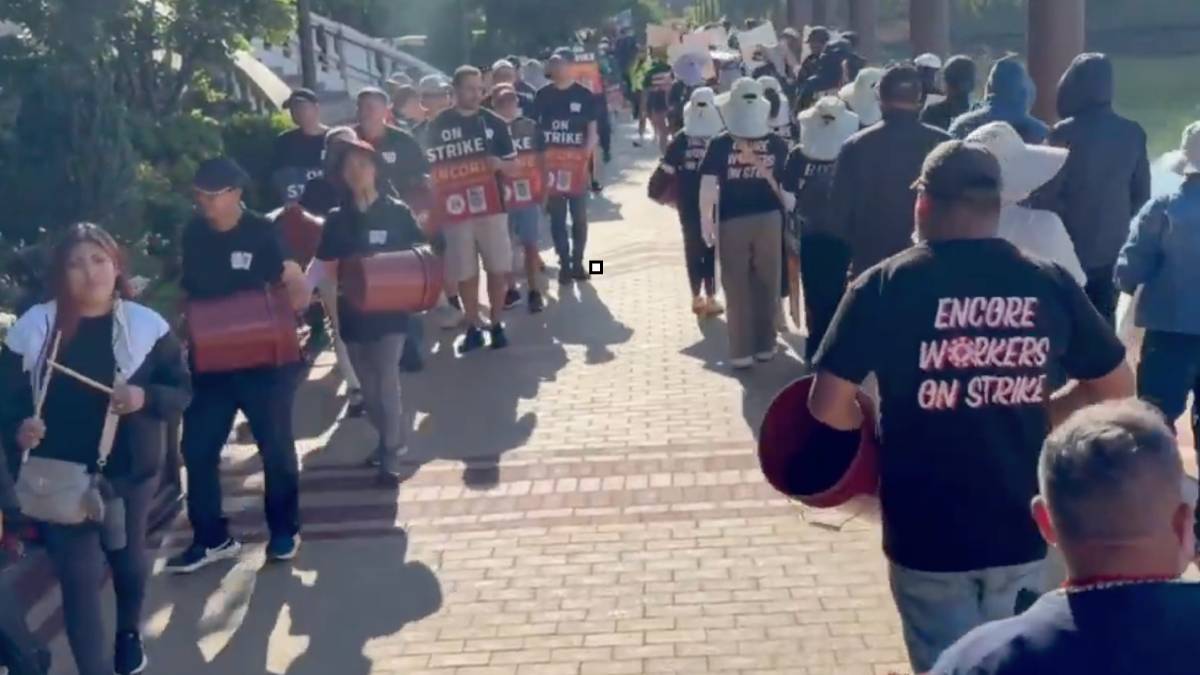 Striking Encore Boston Harbor workers hold signs outside the Everett, Massachusetts casino and hotel.