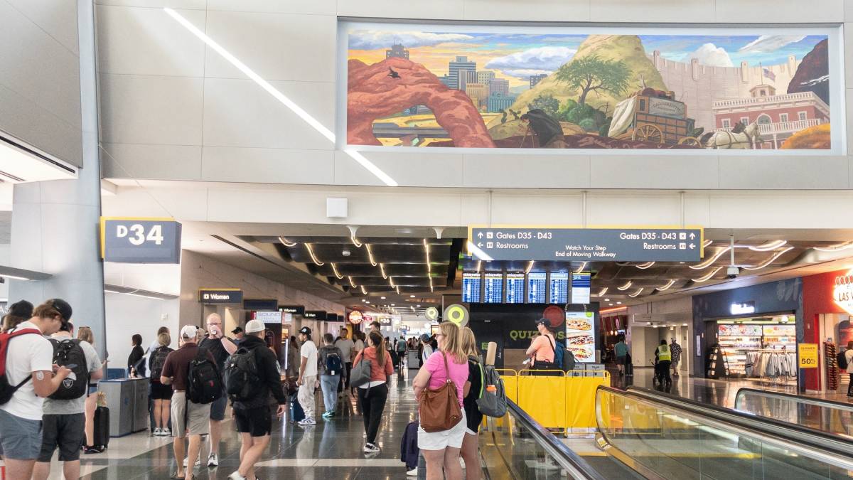 Travelers walk through Harry Reid International Airport in Las Vegas as passenger traffic declines in July 2026