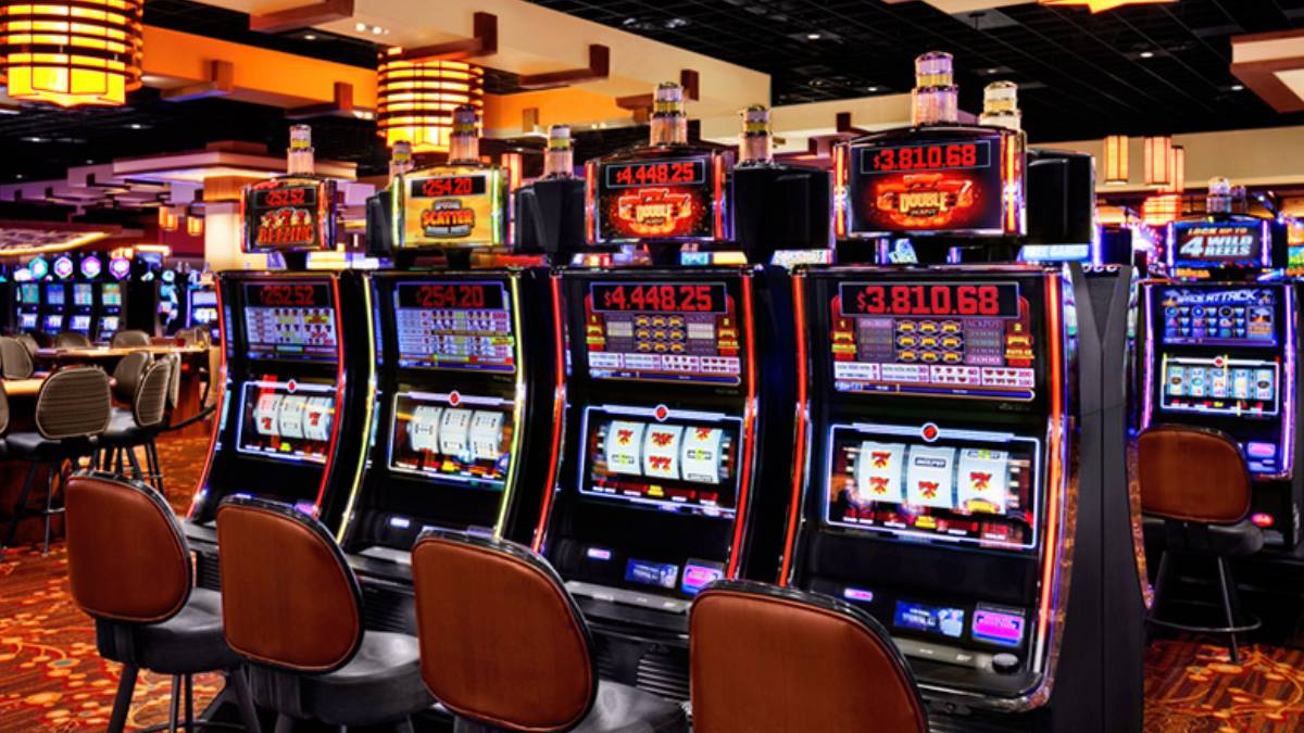 Players seated at live table games and slot machines inside Kansas Star Casino in Mulvane