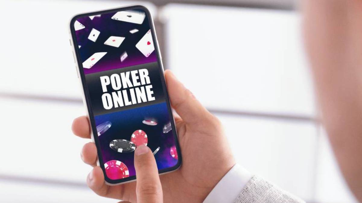 a person plays an online poker game on a phone, while there is an ongoing discussion about legalizing real-money online casino games in the buckeye state of ohio.