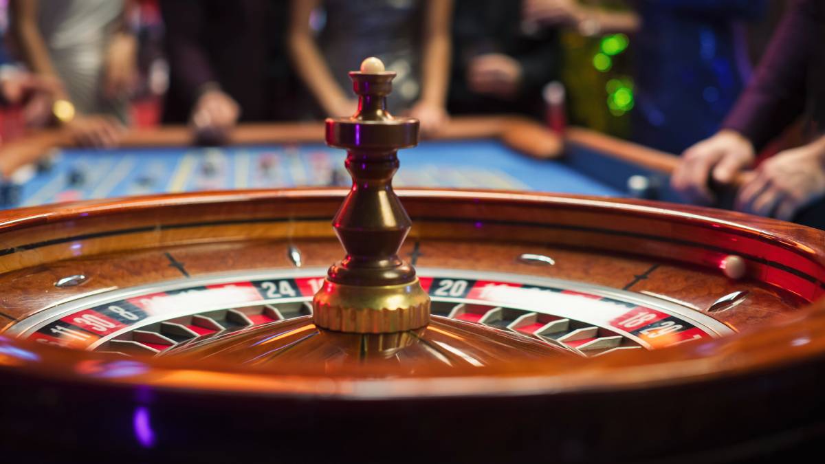 Casino dealer operating a live roulette table at Tropicana Atlantic City