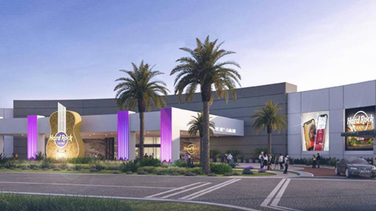 the entrance to the Hard Rock Tejon Casino features palm trees.